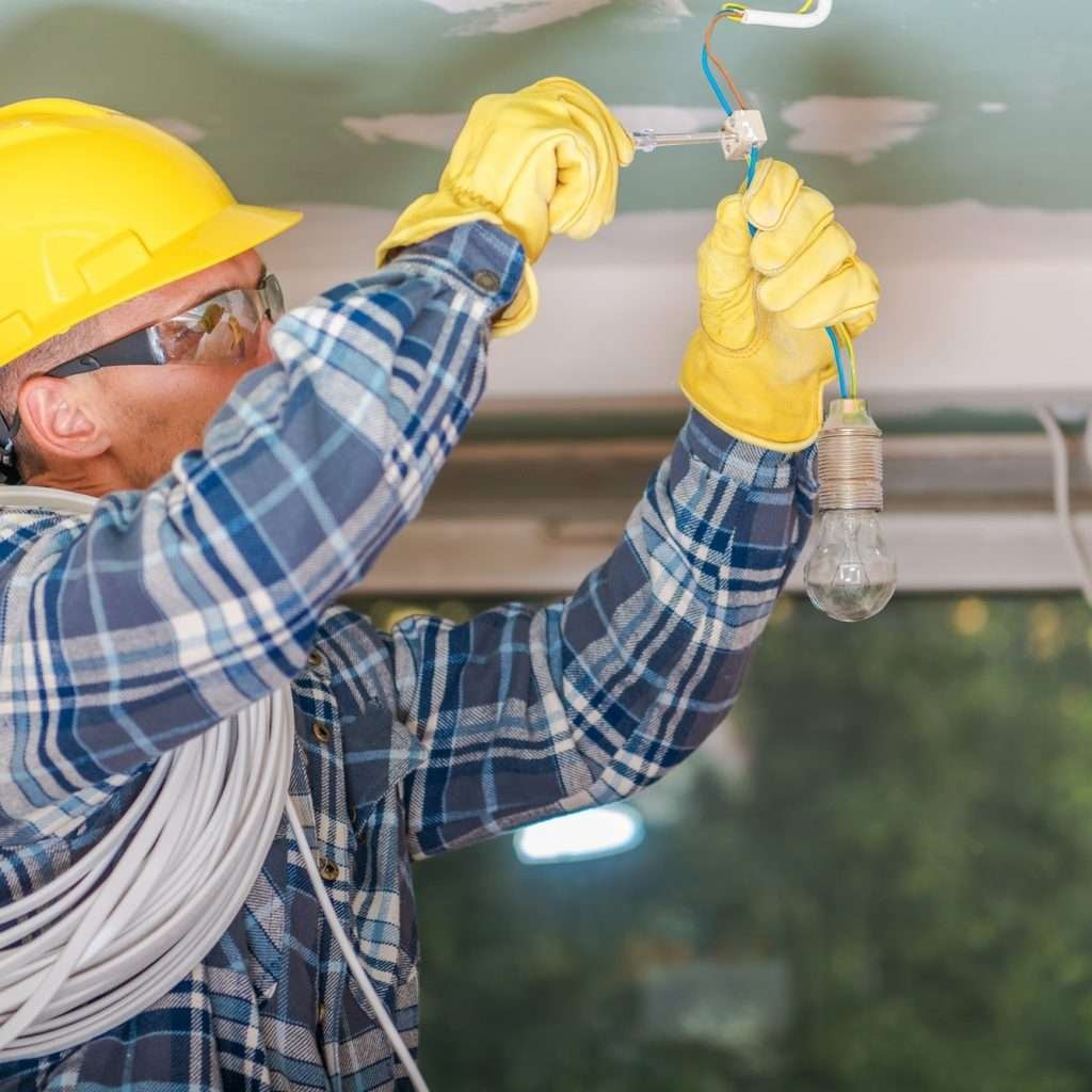 caucasian electrician at work