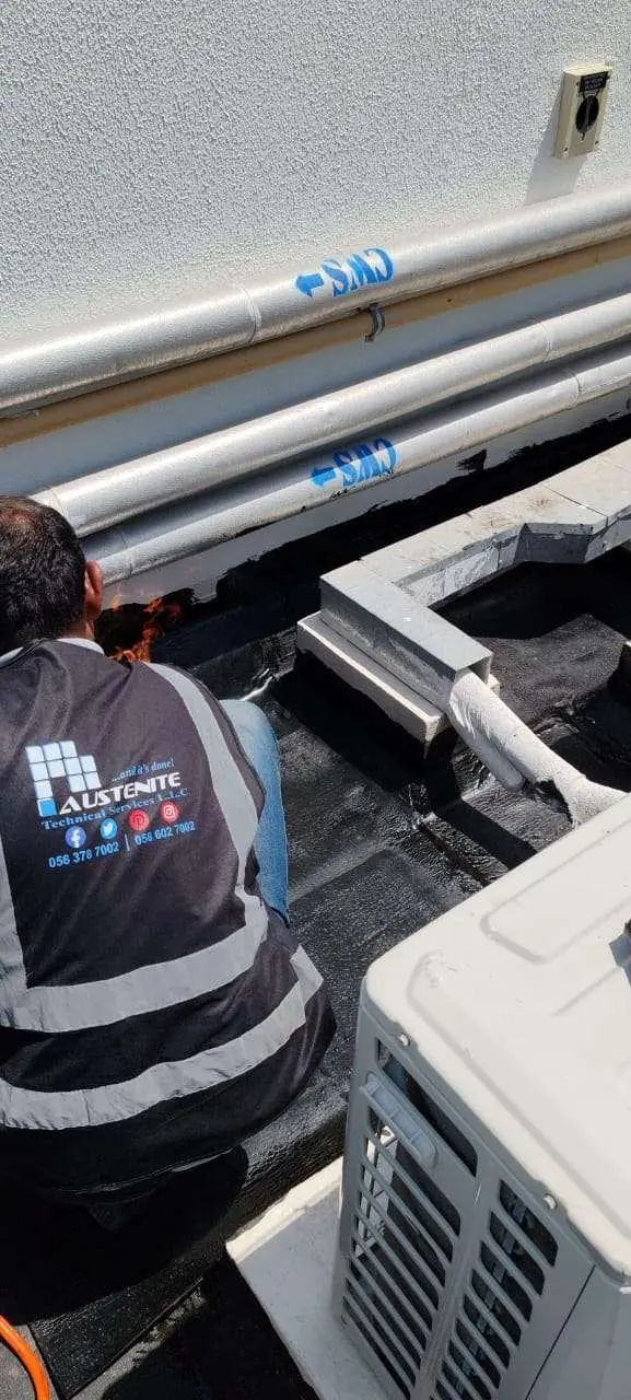 Waterproofing membrane detailed around AC equipment on a Dubai villa roof