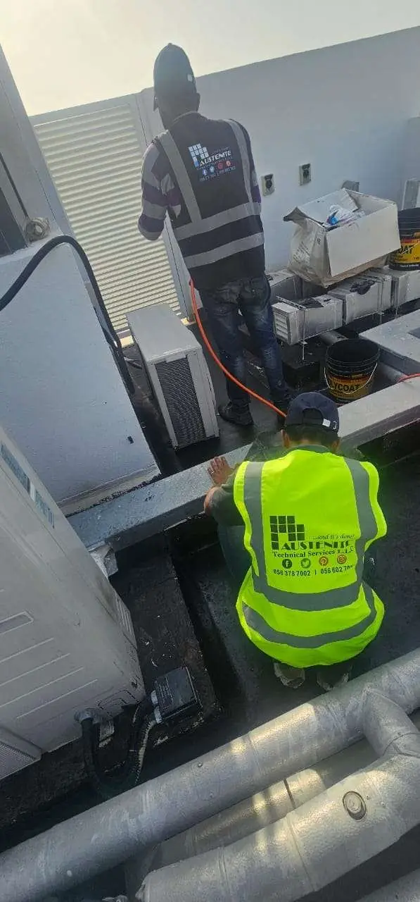 Waterproofing membrane detailed at an AC unit upstand on a Dubai villa roof
