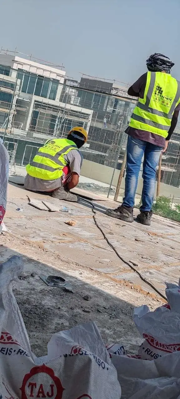 Concrete surface being prepared before waterproofing